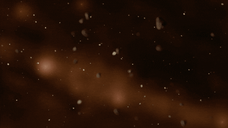 Small specs of white and tan drift by, and a large, irregular shape floats into the image from the left, traveling to the right and down until it disappears off the bottom of the frame.