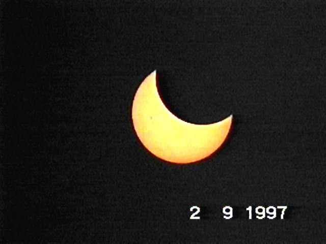 APOD: 1997 September 03 – A Partial Eclipse in Southern Skies