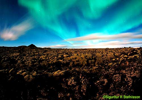 APOD: 2001 April 2 – Aurora Over Clouds