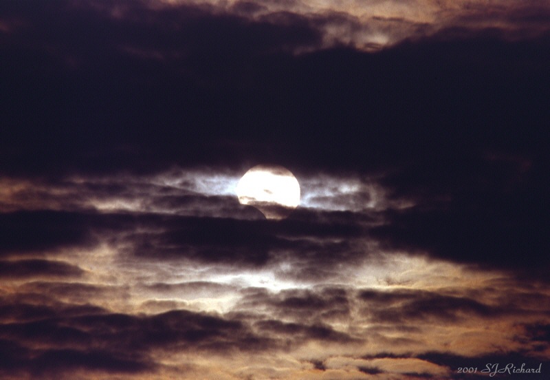 APOD: 2001 December 21 – Partial Eclipse, Cloudy Day