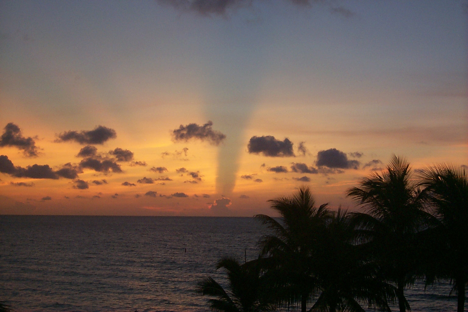 APOD: 2002 February 27 – A Cloud Shadow Sunrise