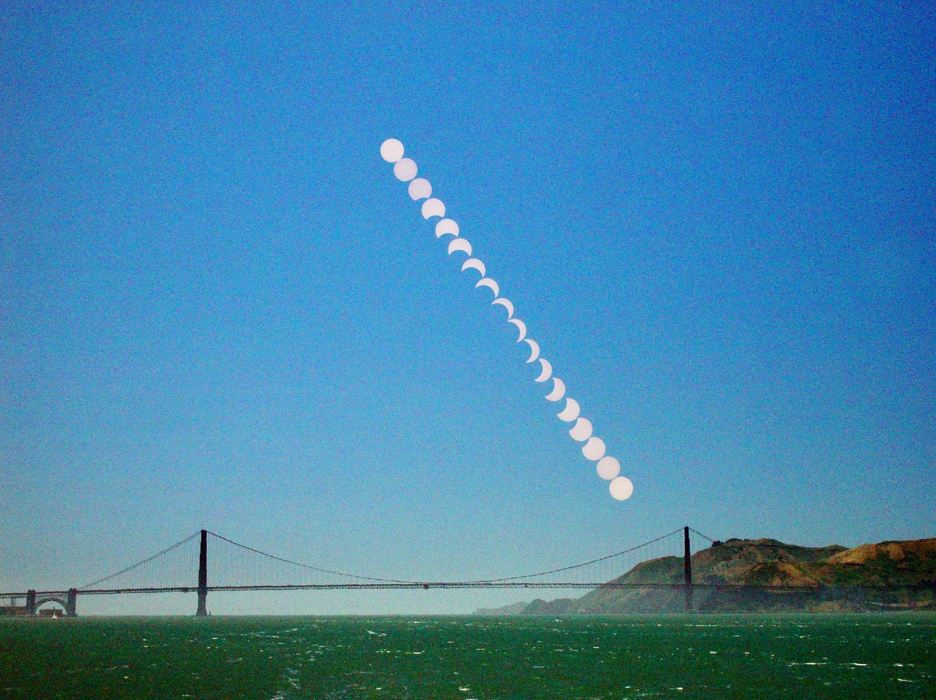 APOD: 2002 June 12 – A Partial Eclipse Over the Golden Gate Bridge