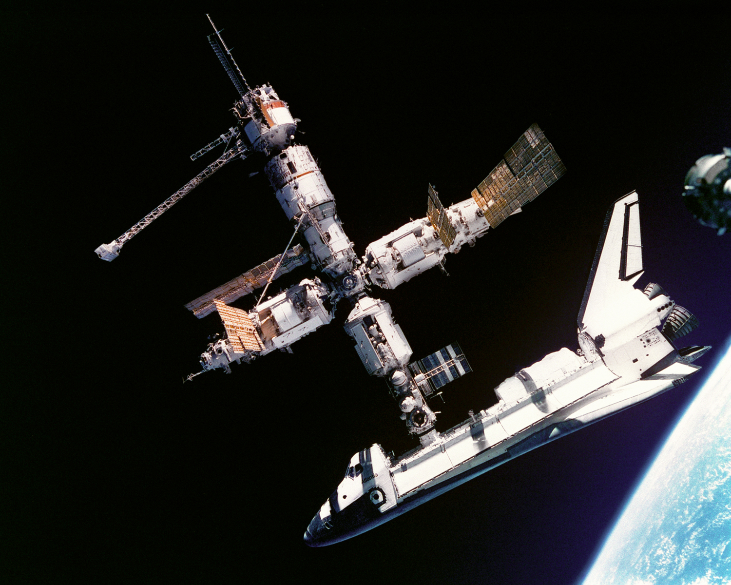 APOD: 2002 October 20 – The Space Shuttle Docked with Mir