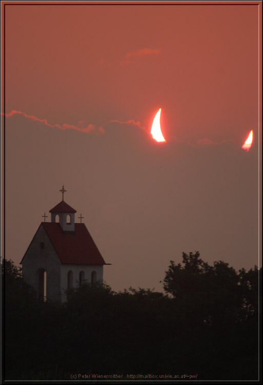 APOD: 2003 June 18 – Clouds and the Moon Move to Block the Sun