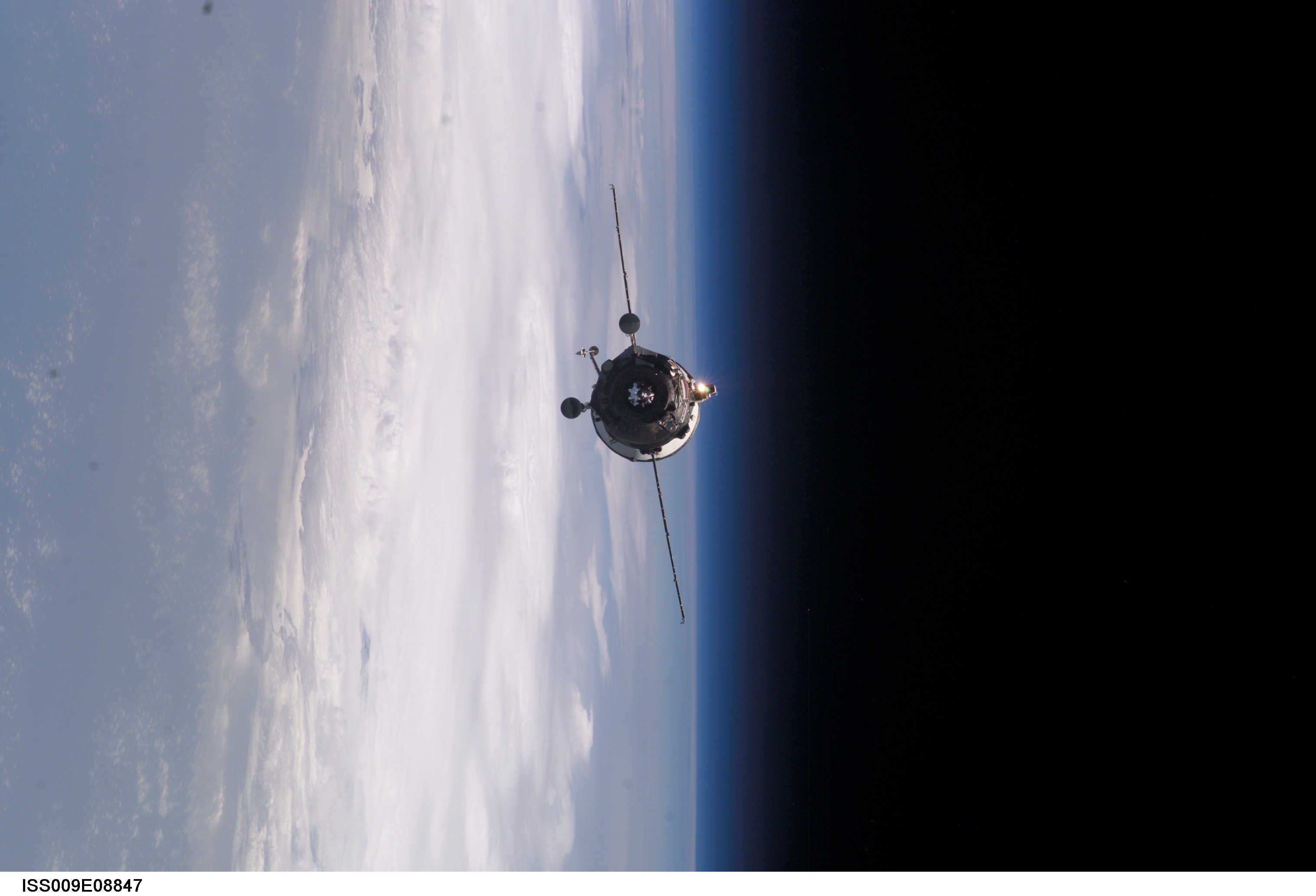 APOD: 2004 August 24- Supply Ship Approaches the Space Station