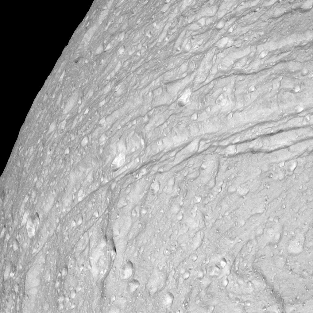 APOD: 2005 October 12 – Cratered Cliffs of Ice on Saturns Tethys