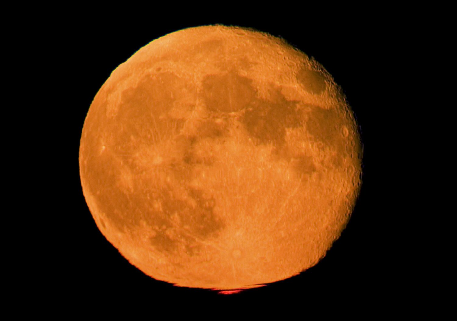APOD: 2005 September 22 – Orange Moon, Red Flash