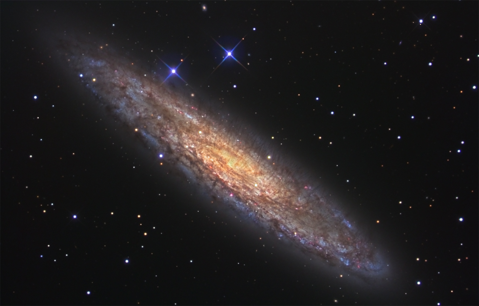 APOD: 2006 April 21 – NGC 253: Dusty Island Universe