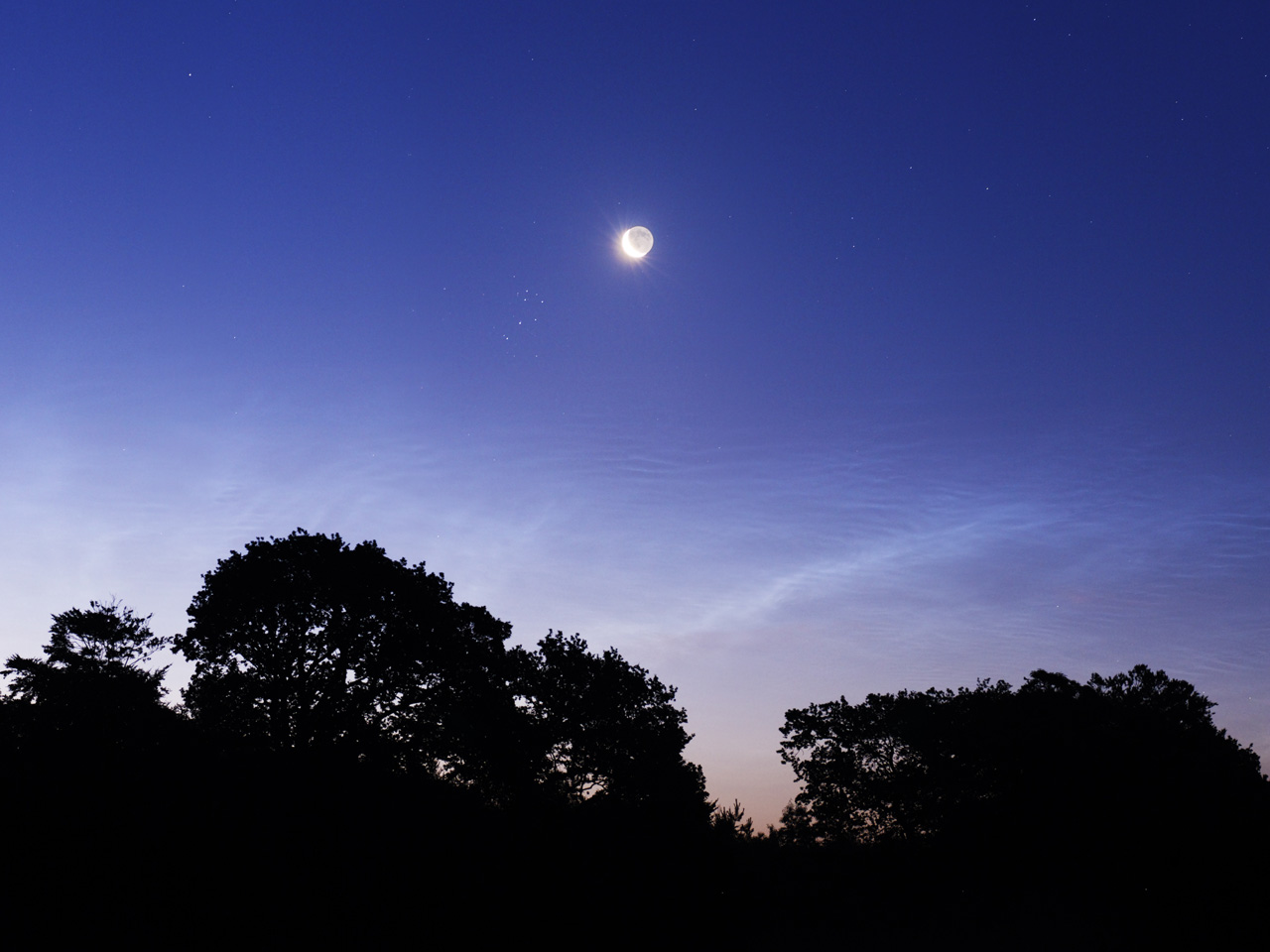 APOD: 2008 July 2 – Night Shinings