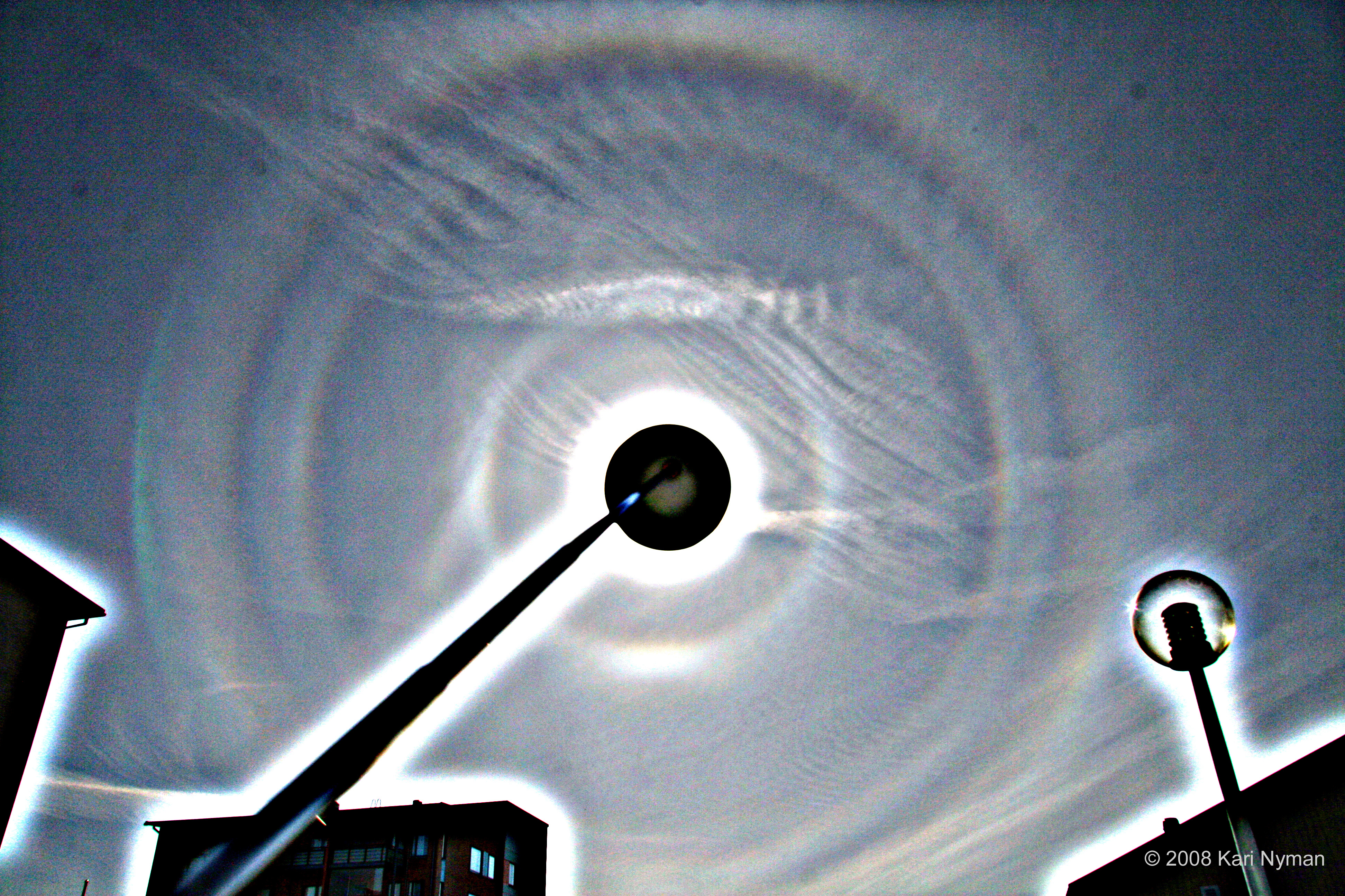 APOD: 2008 June 18 – Pyramid Ice Crystal Halos Over Finland