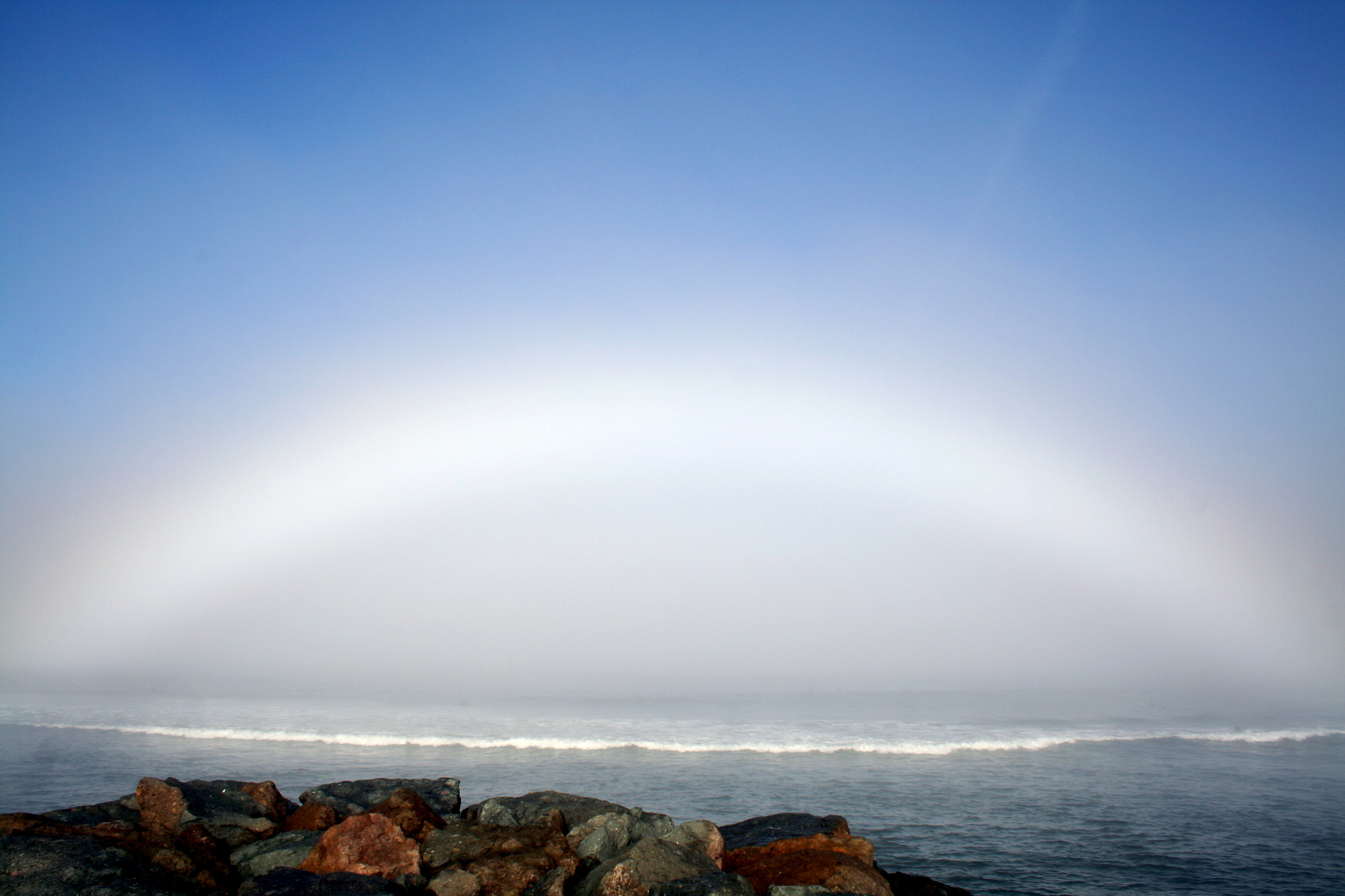 APOD: 2008 May 29 – A Fog Bow Over Ocean Beach