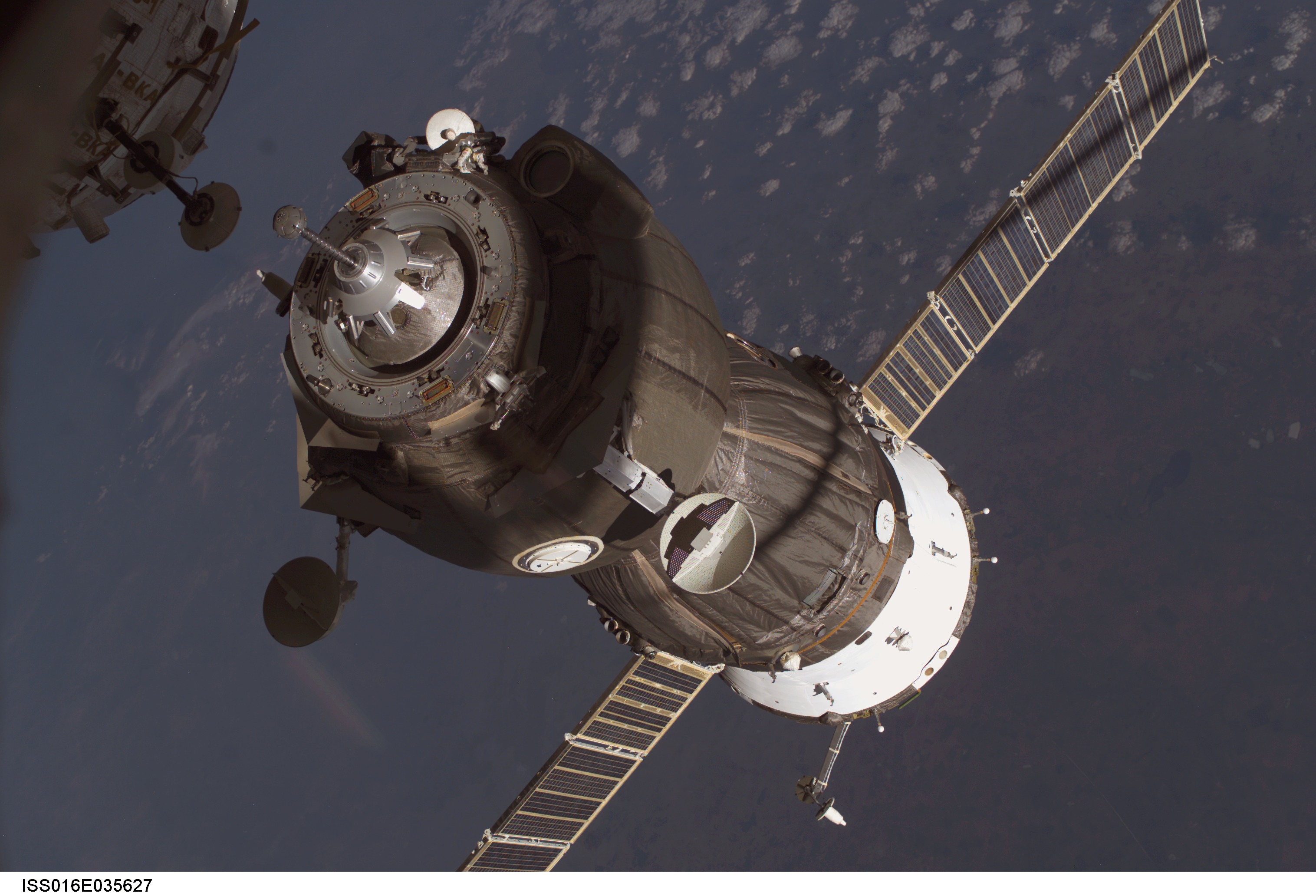 APOD: 2008 May 14 – A Supply Ship Docks with the International Space Station