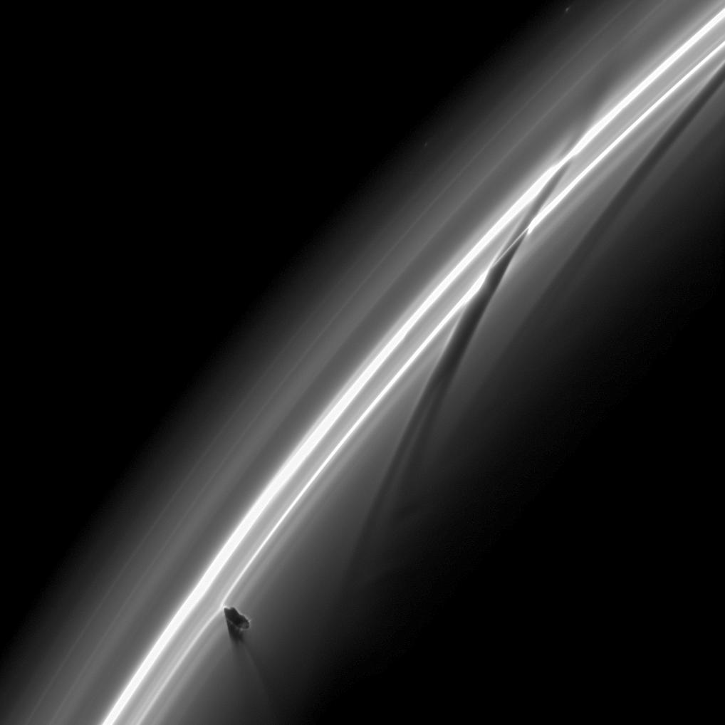APOD: 2009 April 27 – Prometheus Creating Saturn Ring Streamers