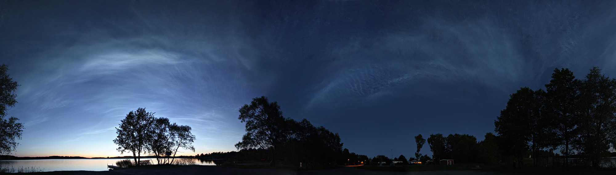 APOD: 2009 July 11 – Noctilucent Cloud Storm Panorama