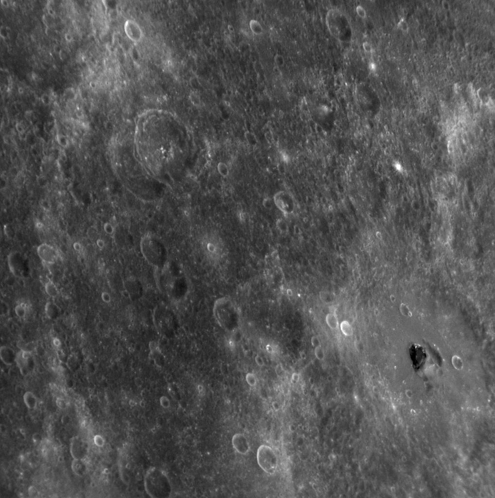 APOD: 2009 July 6 – Unknown Dark Material on Mercury