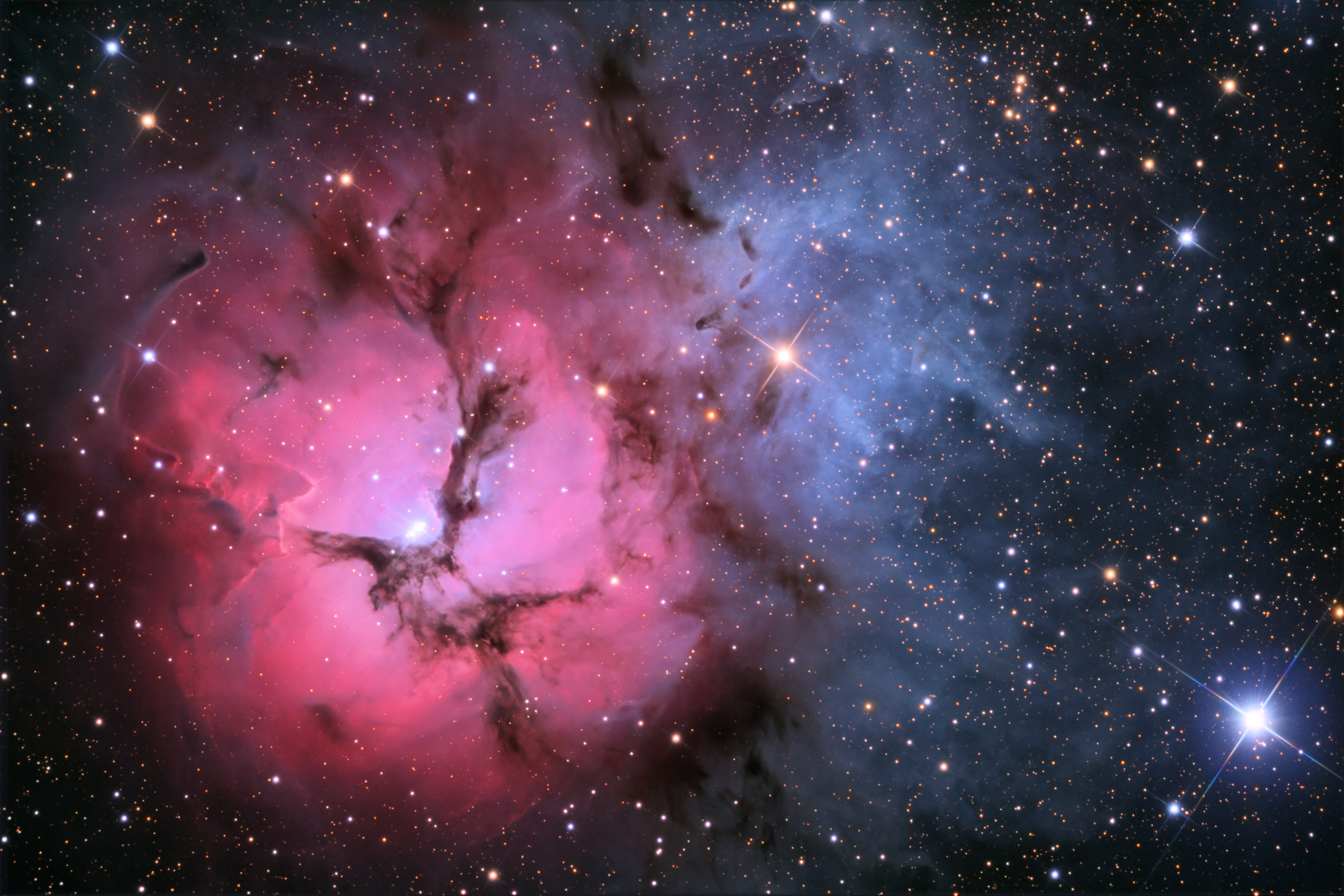 APOD: 2009 July 7 – The Trifid Nebula in Stars and Dust