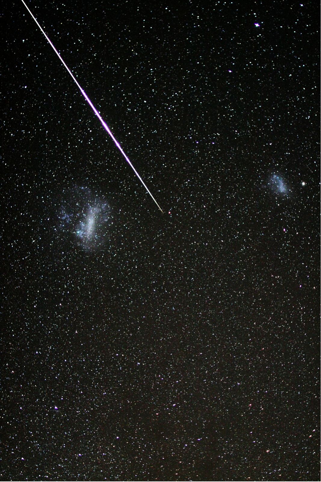 APOD: 2009 November 20 – Meteor between the Clouds