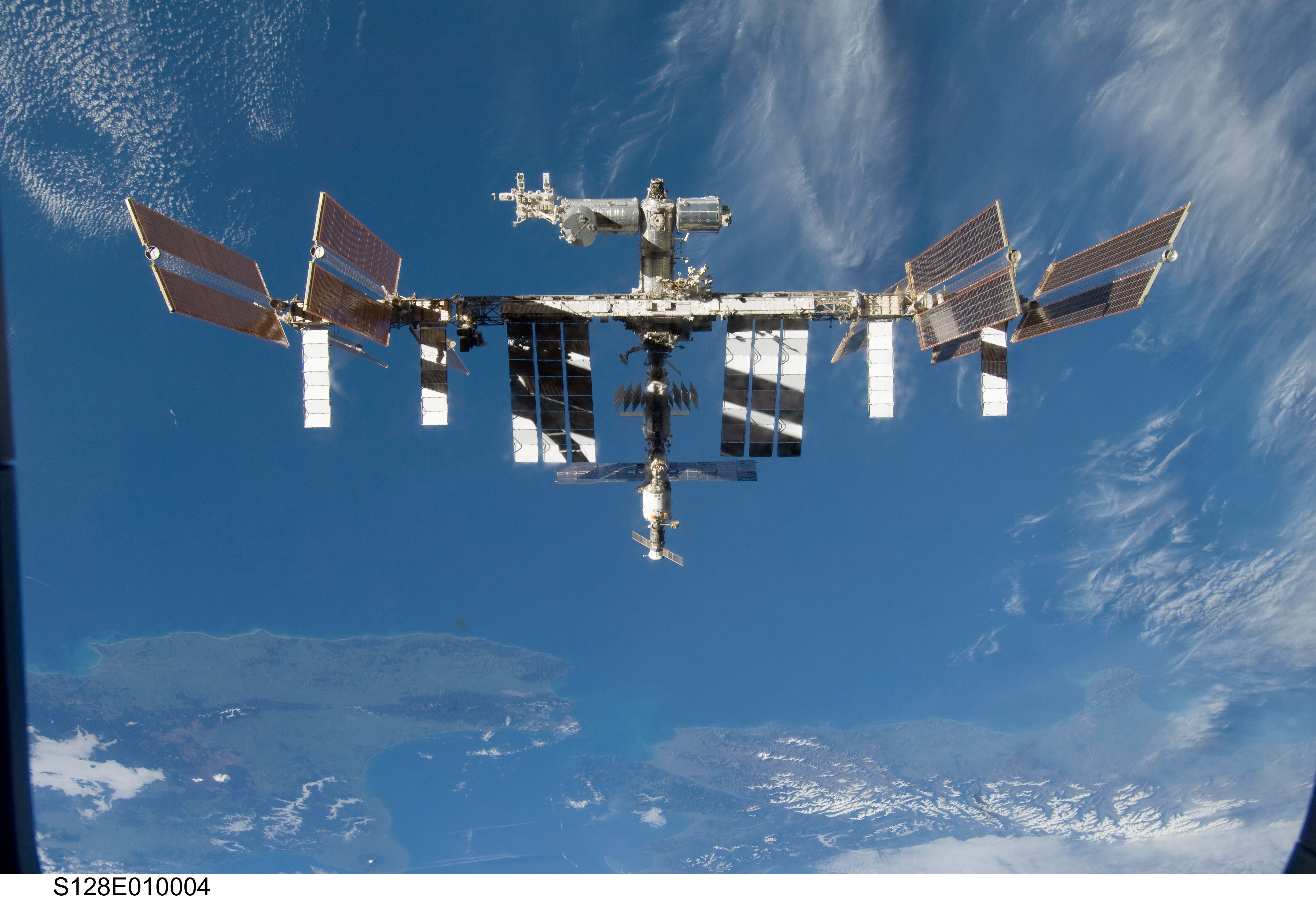 APOD: 2009 October 5 – The International Space Station Over Earth