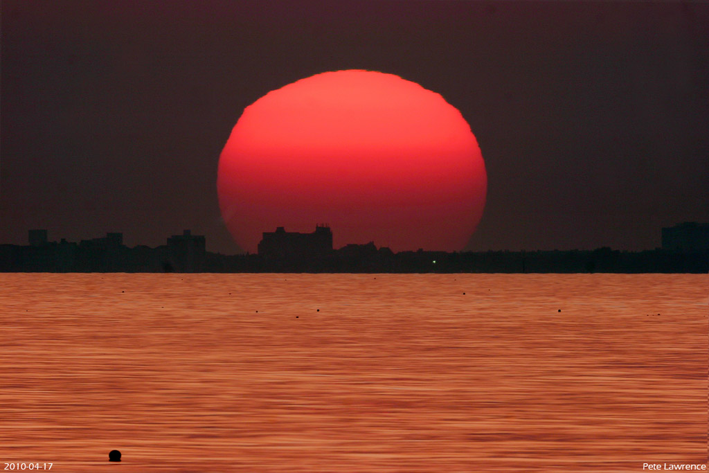 APOD: 2010 April 28 – Sunset on a Golden Sea