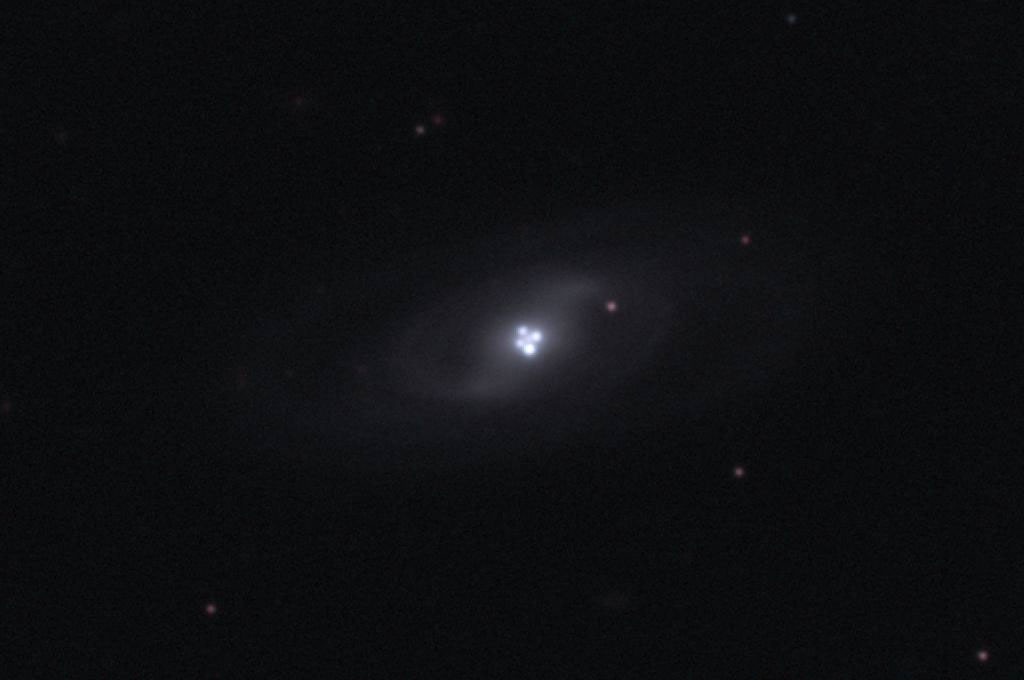 The Einstein Cross Gravitational Lens — APOD for 2010-02-07