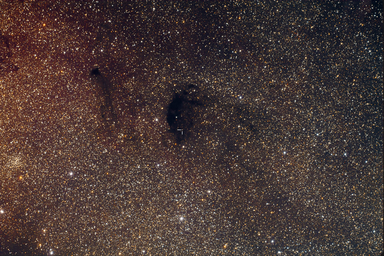 APOD: 2010 July 8 – Dim World, Dark Nebula