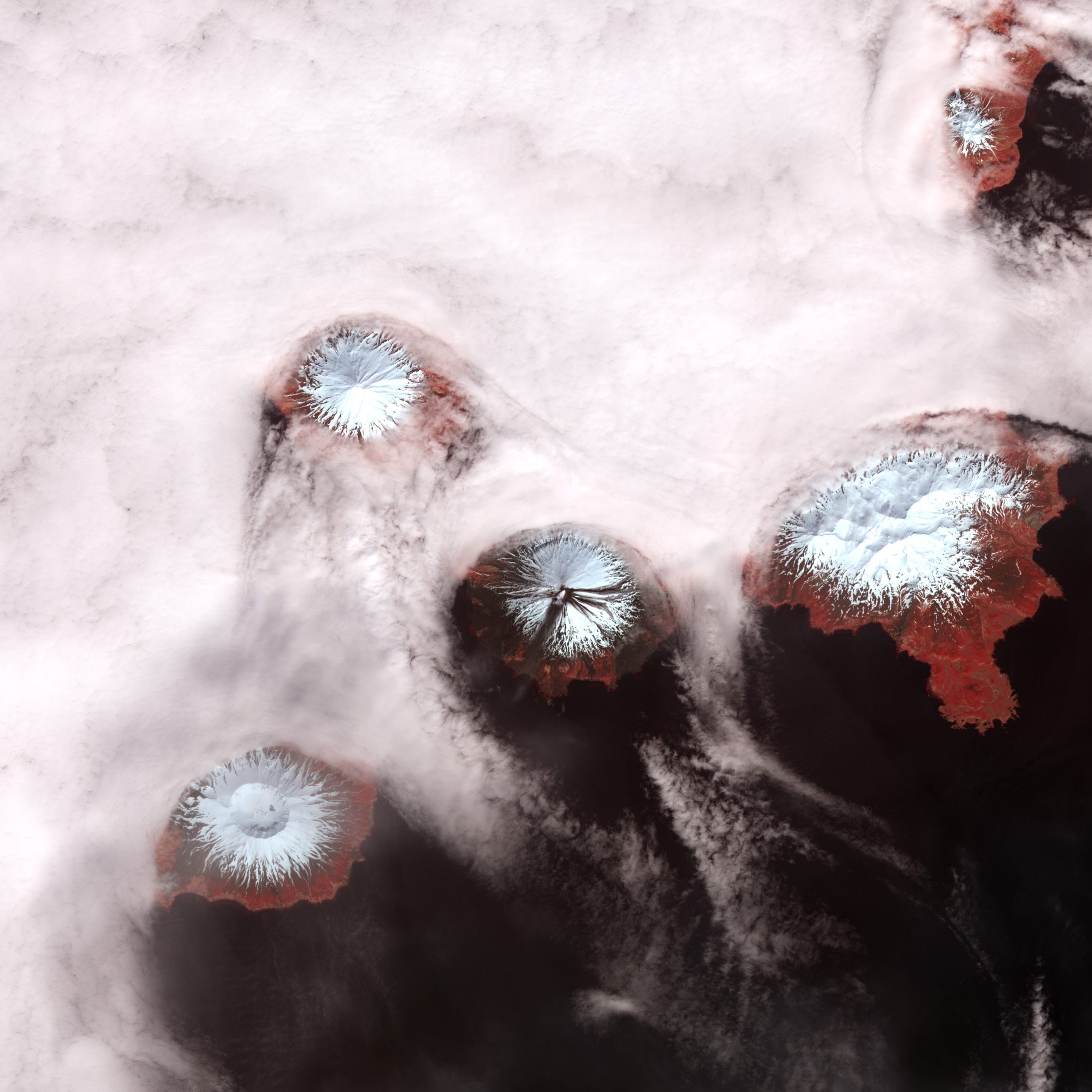 APOD: 2010 June 22 – Islands of Four Mountains from Above