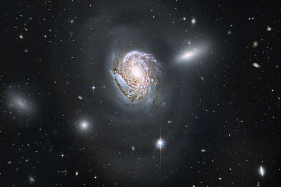 APOD: 2010 September 8 – NGC 4911: Spiral Diving into a Dense Cluster