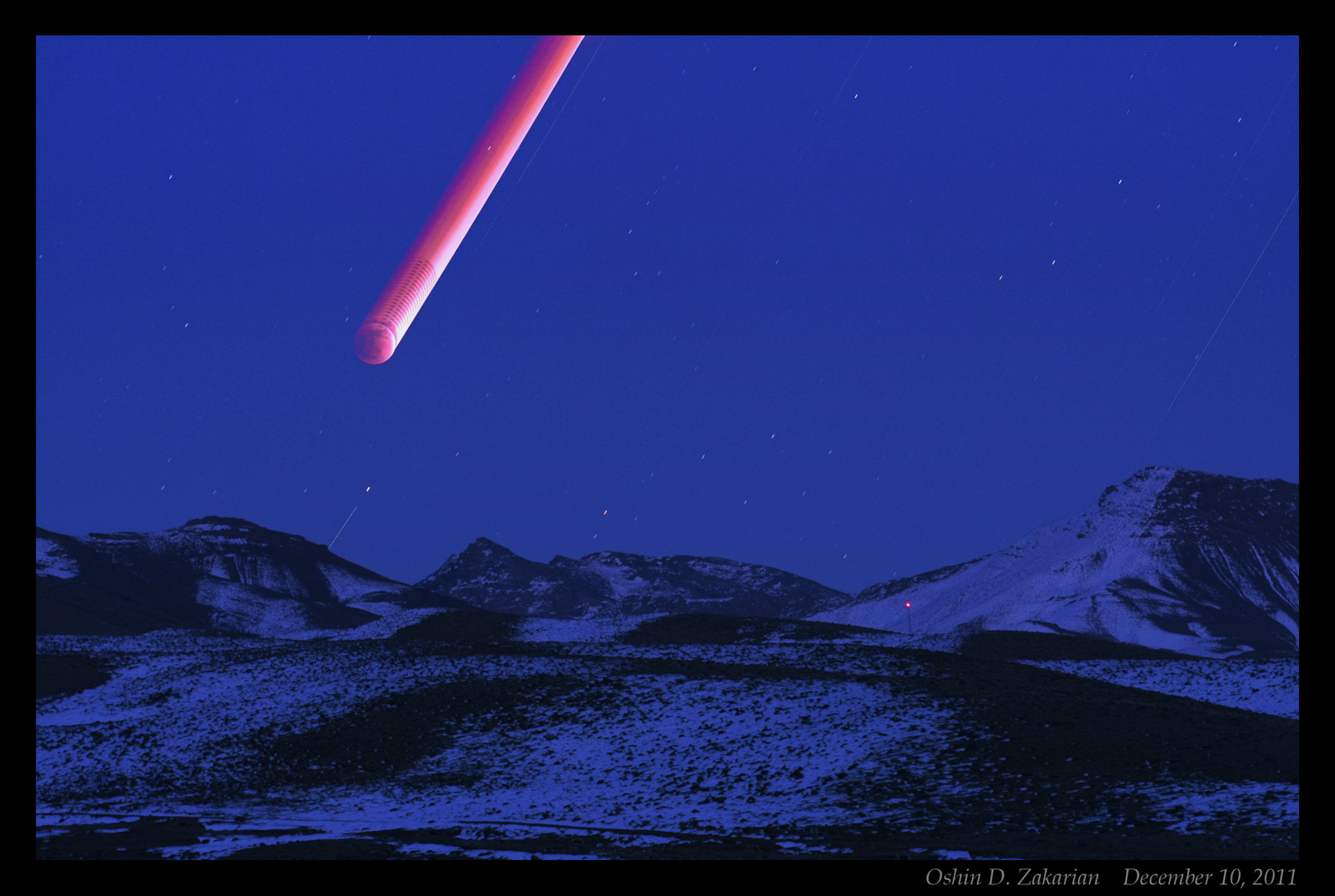 APOD: 2011 December 16 – Red Moon Rising
