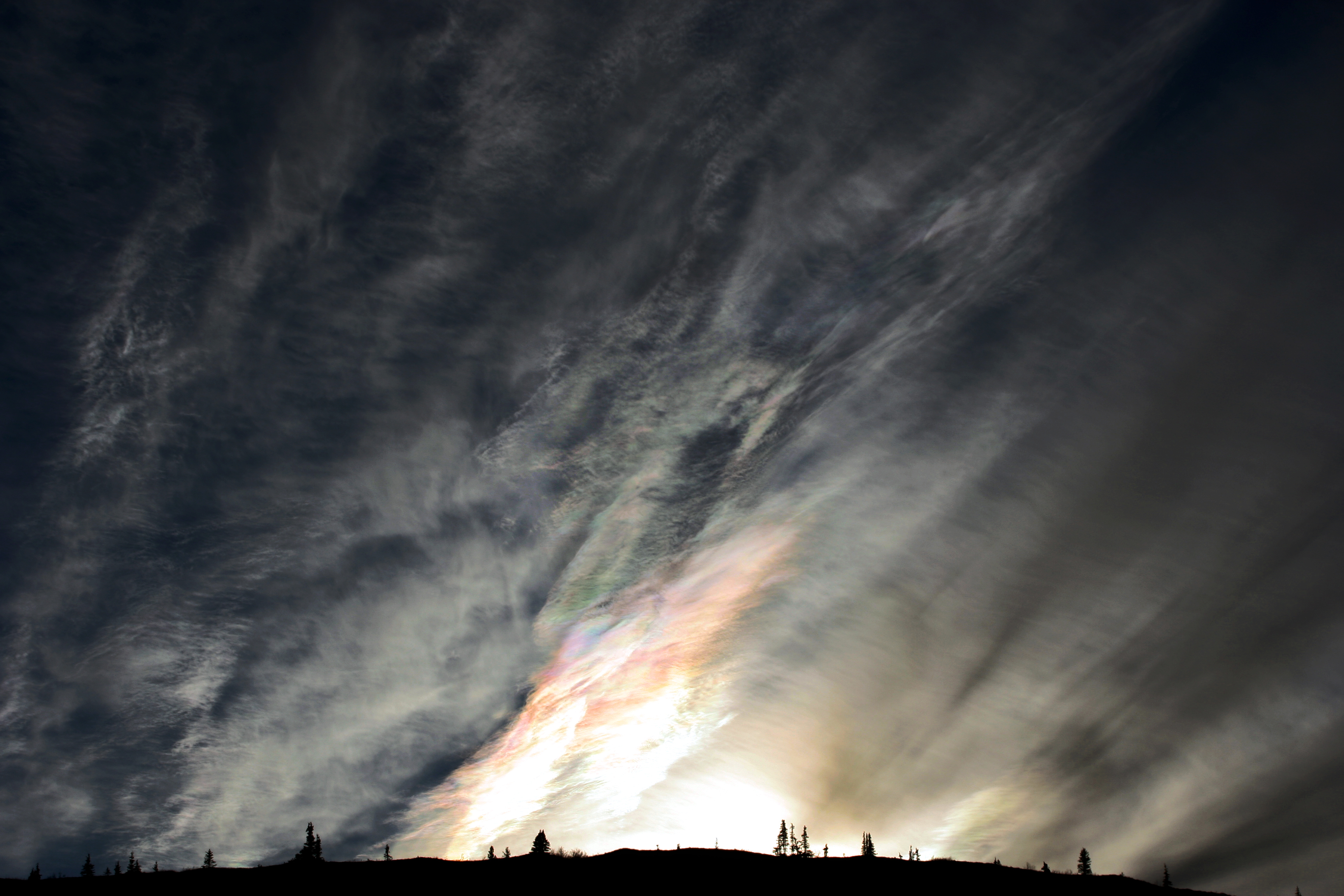 APOD: 2011 February 8 – Iridescent Clouds from the Top of the World Highway