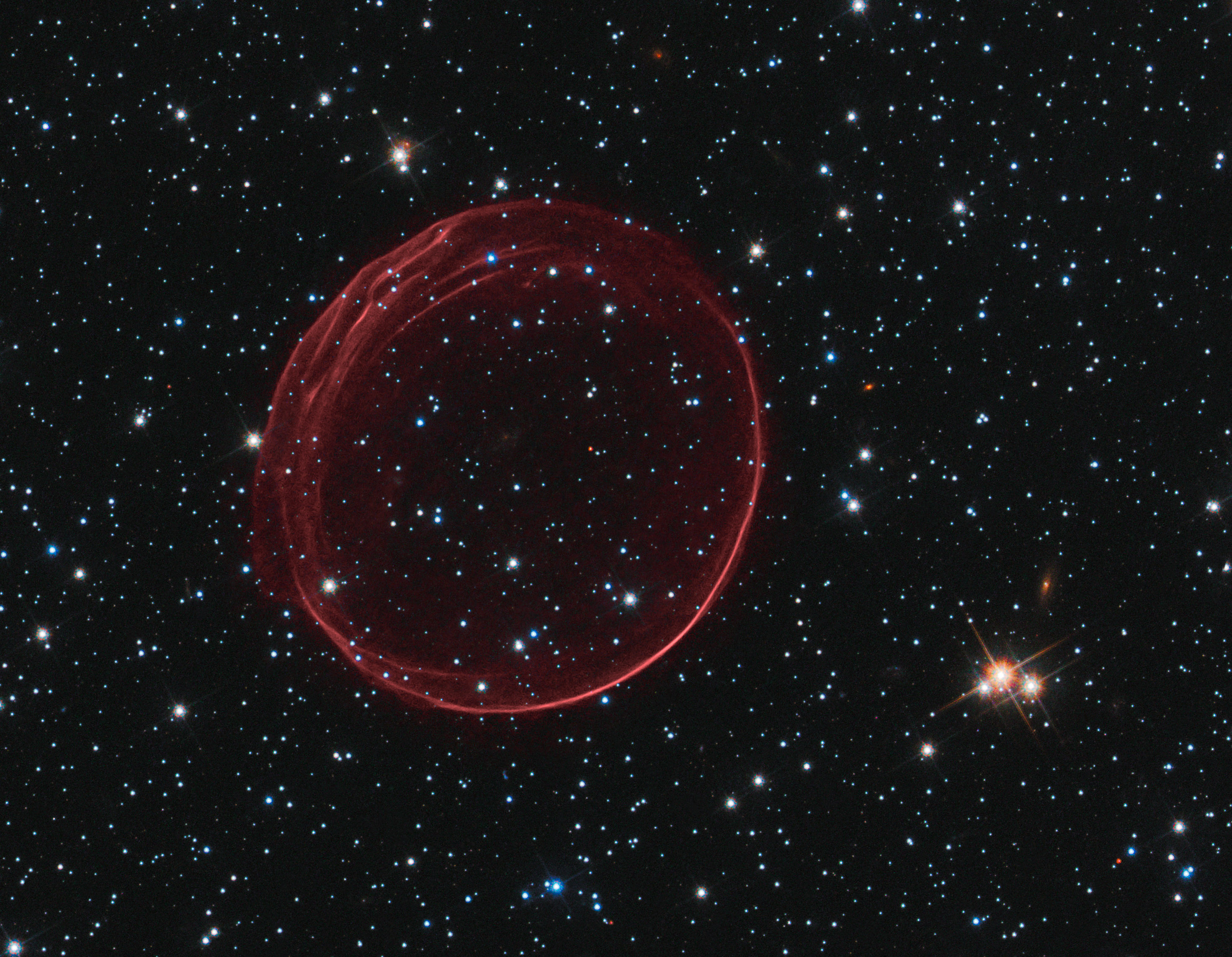 APOD: 2011 January 25 – The Rippled Red Ribbons of SNR 0509