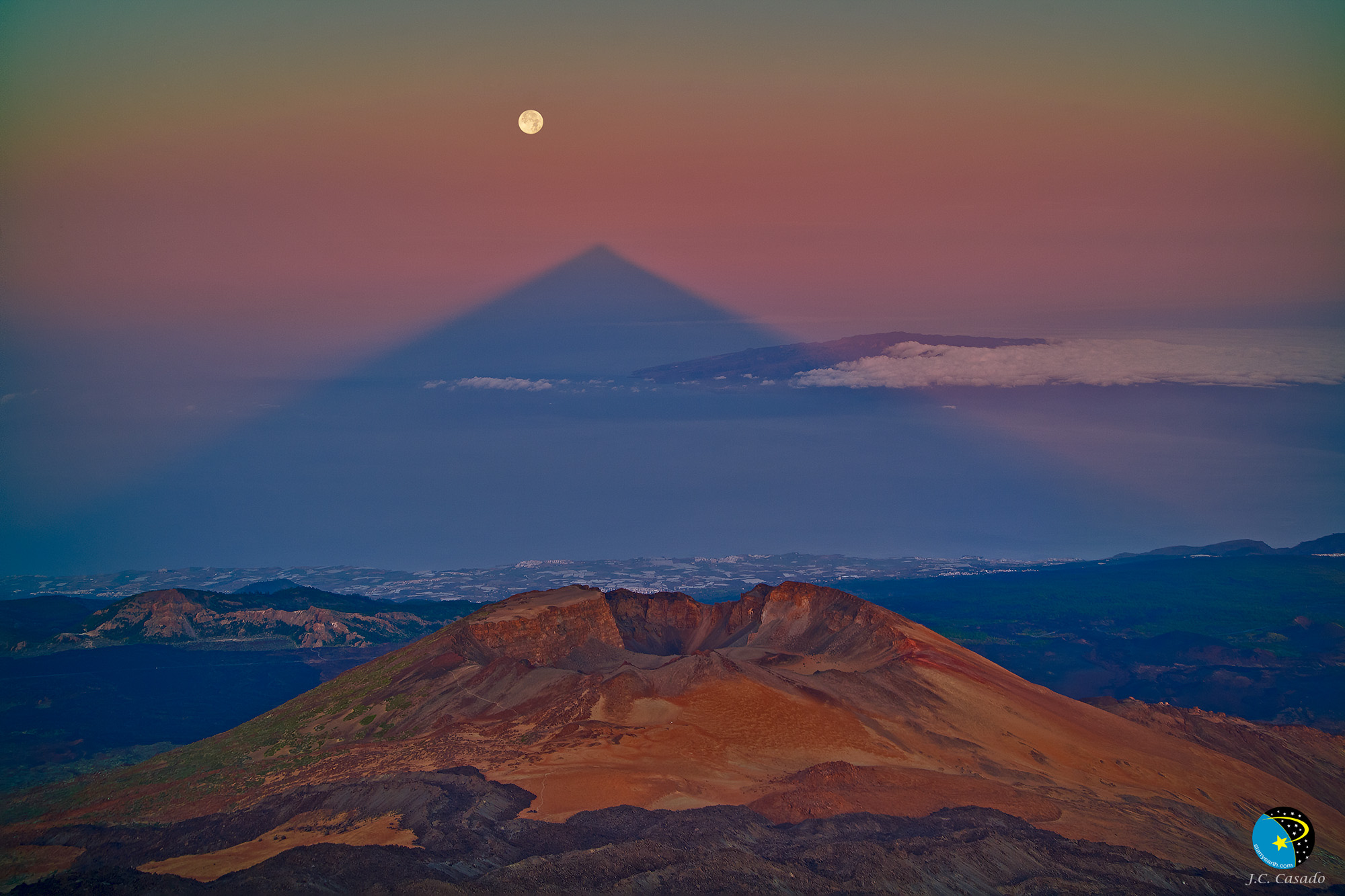 APOD: 2011 July 5 – A Triangular Shadow of a Large Volcano