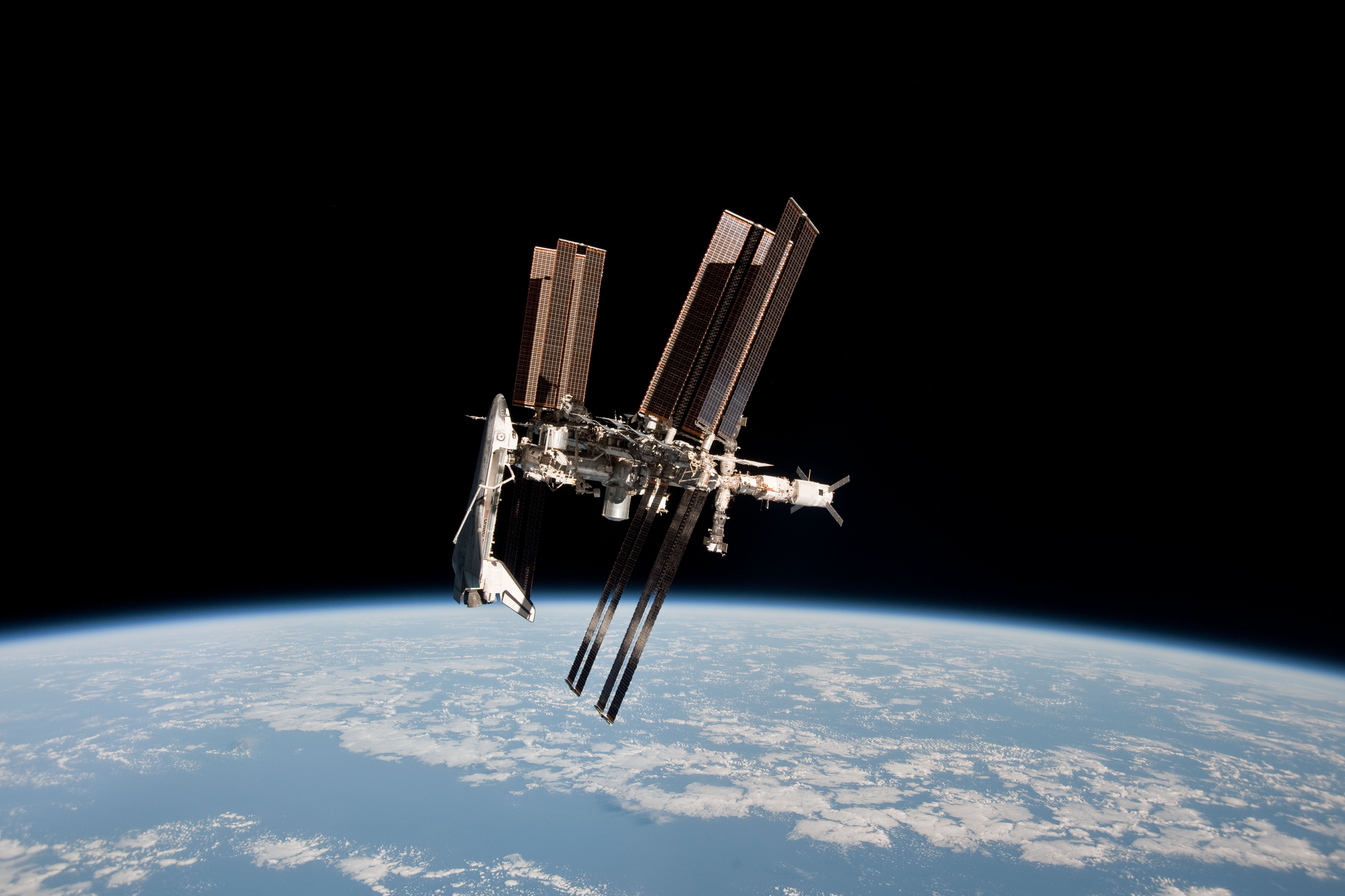 APOD: 2011 June 8 – Space Shuttle and Space Station Photographed Together