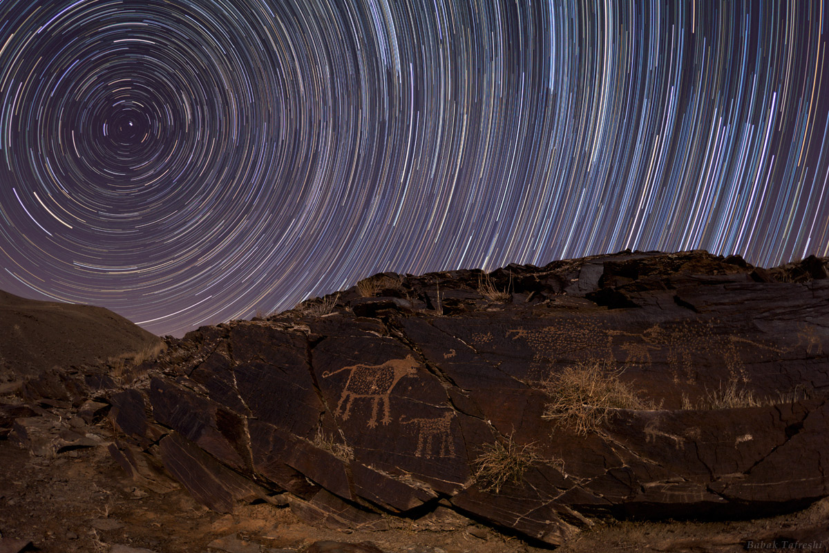 APOD: 2012 July 12 – Teimareh Petroglyphs and Star Trails