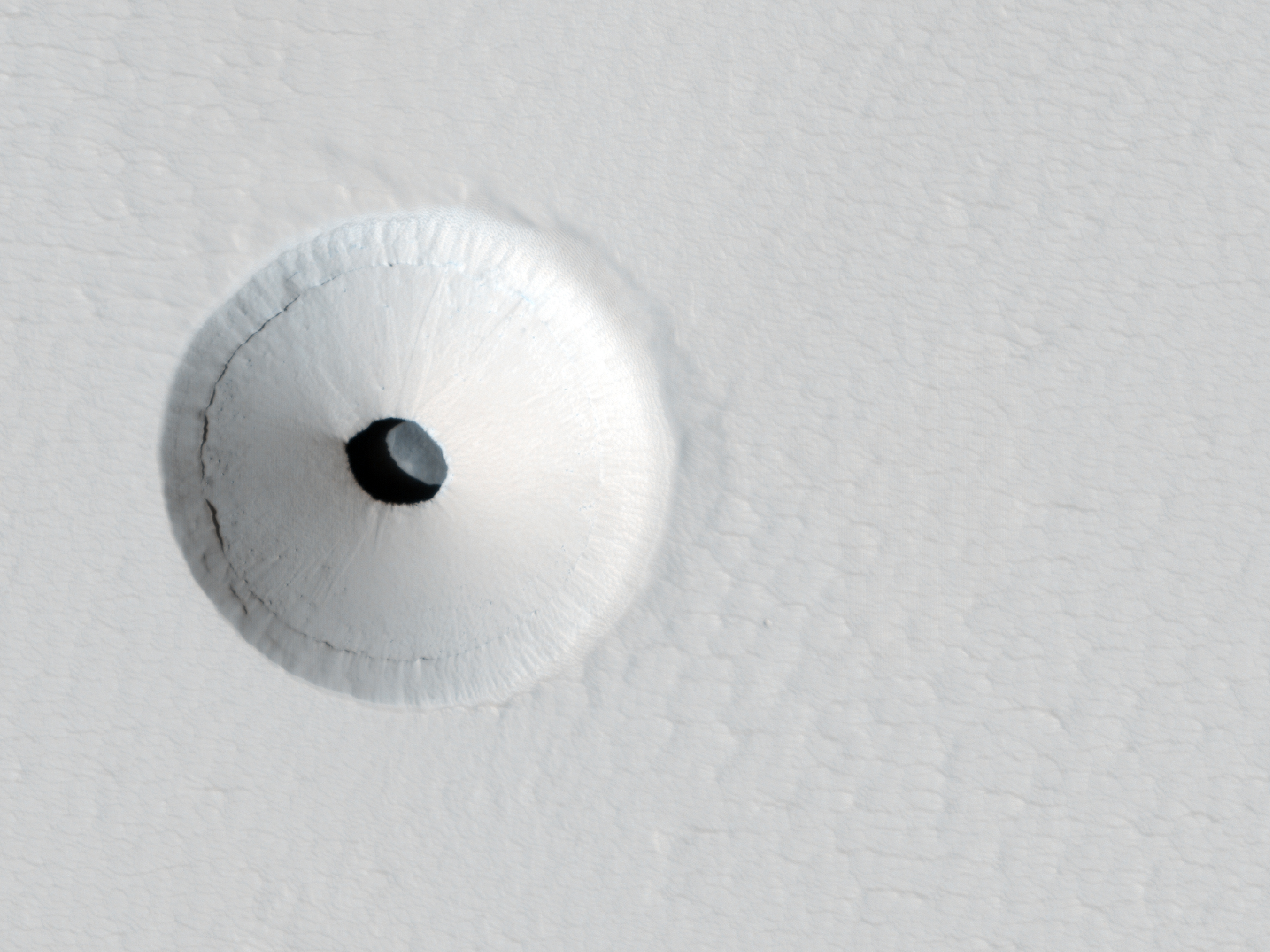 APOD: 2012 July 18 – A Hole in Mars