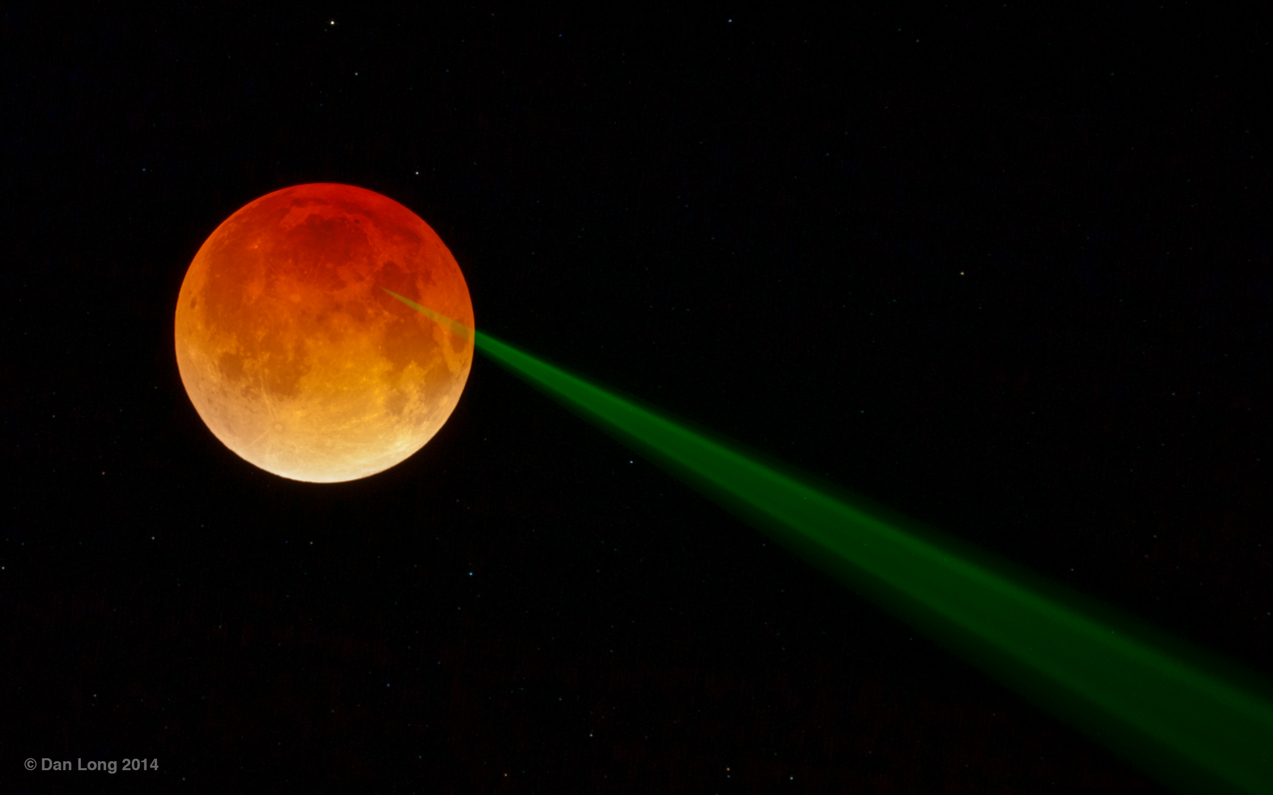 APOD: 2014 April 18 – Red Moon, Green Beam
