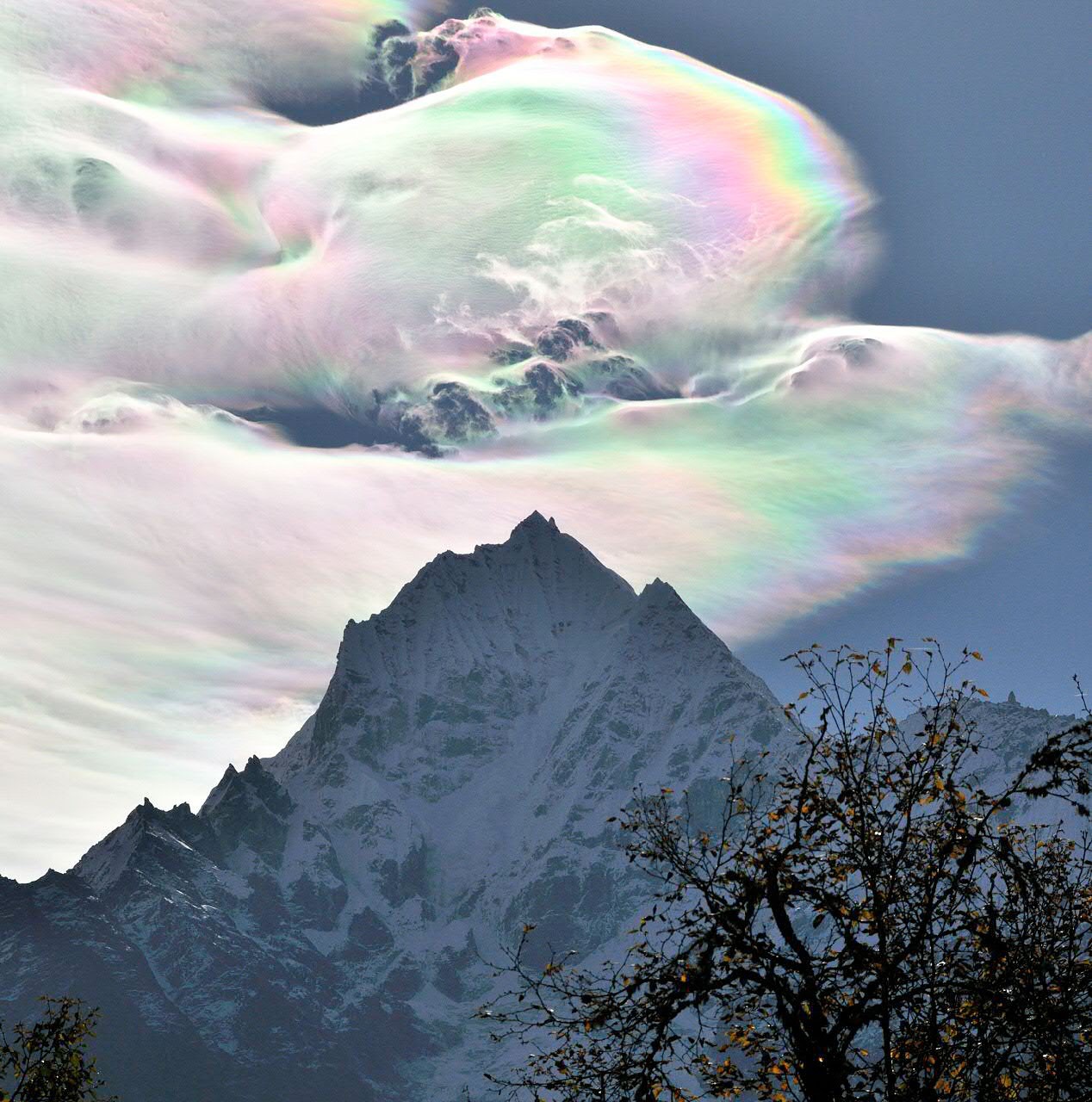 Iridescent Clouds over Thamserku — APOD for 2014-07-08