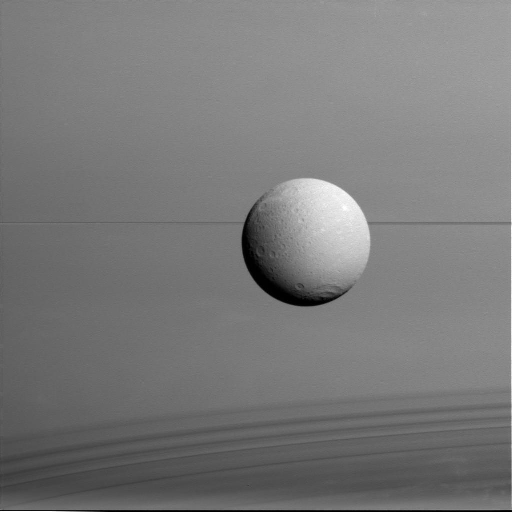 APOD: 2015 August 24 – Dione, Rings, Shadows, Saturn