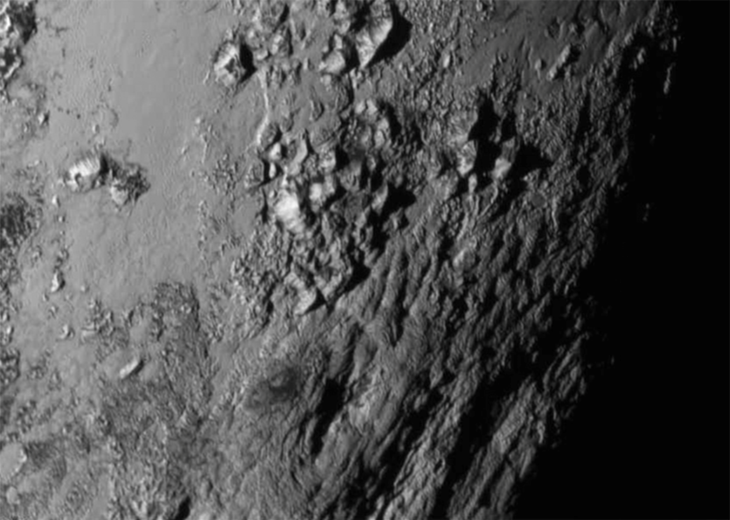 APOD: 2015 July 16 – 50 Miles on Pluto