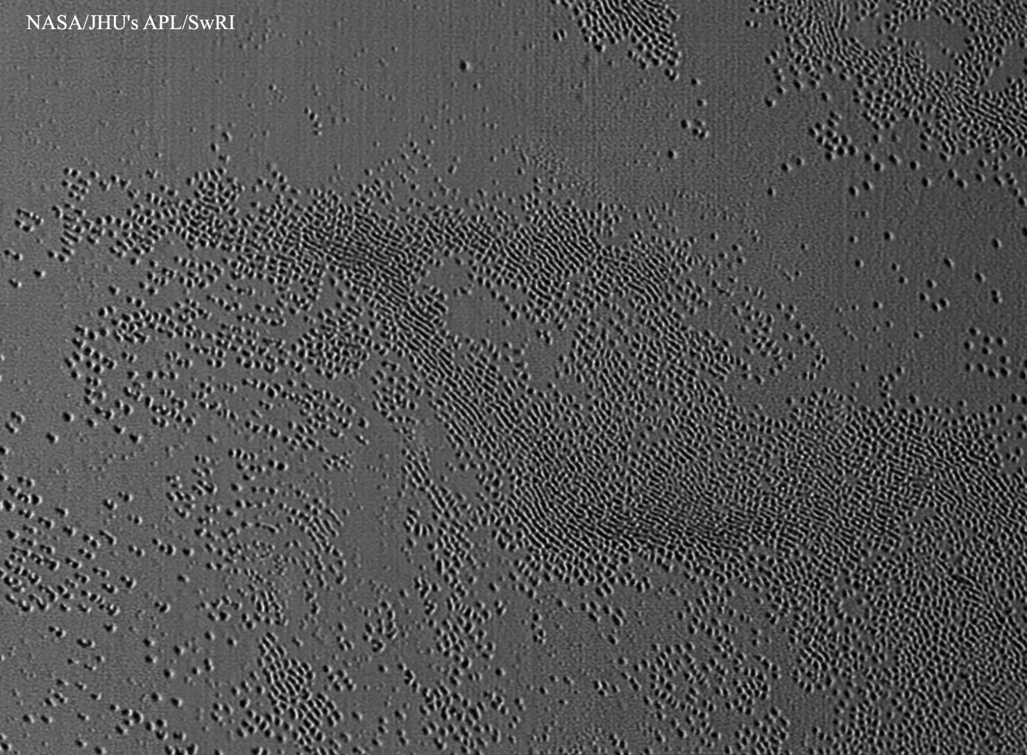 APOD: 2015 November 25 – Unusual Pits Discovered on Pluto