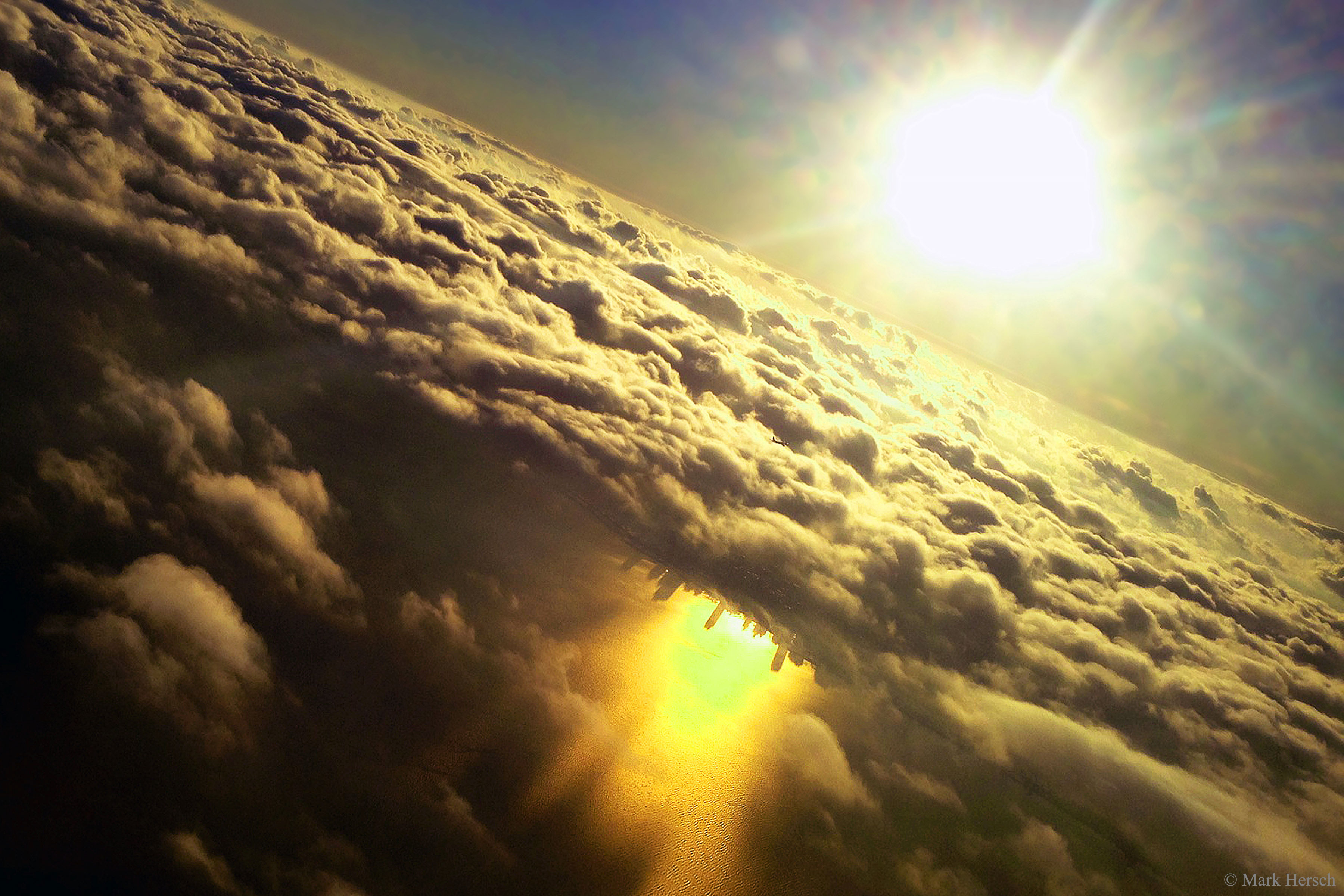 APOD: 2016 November 7 – Inverted City Beneath Clouds