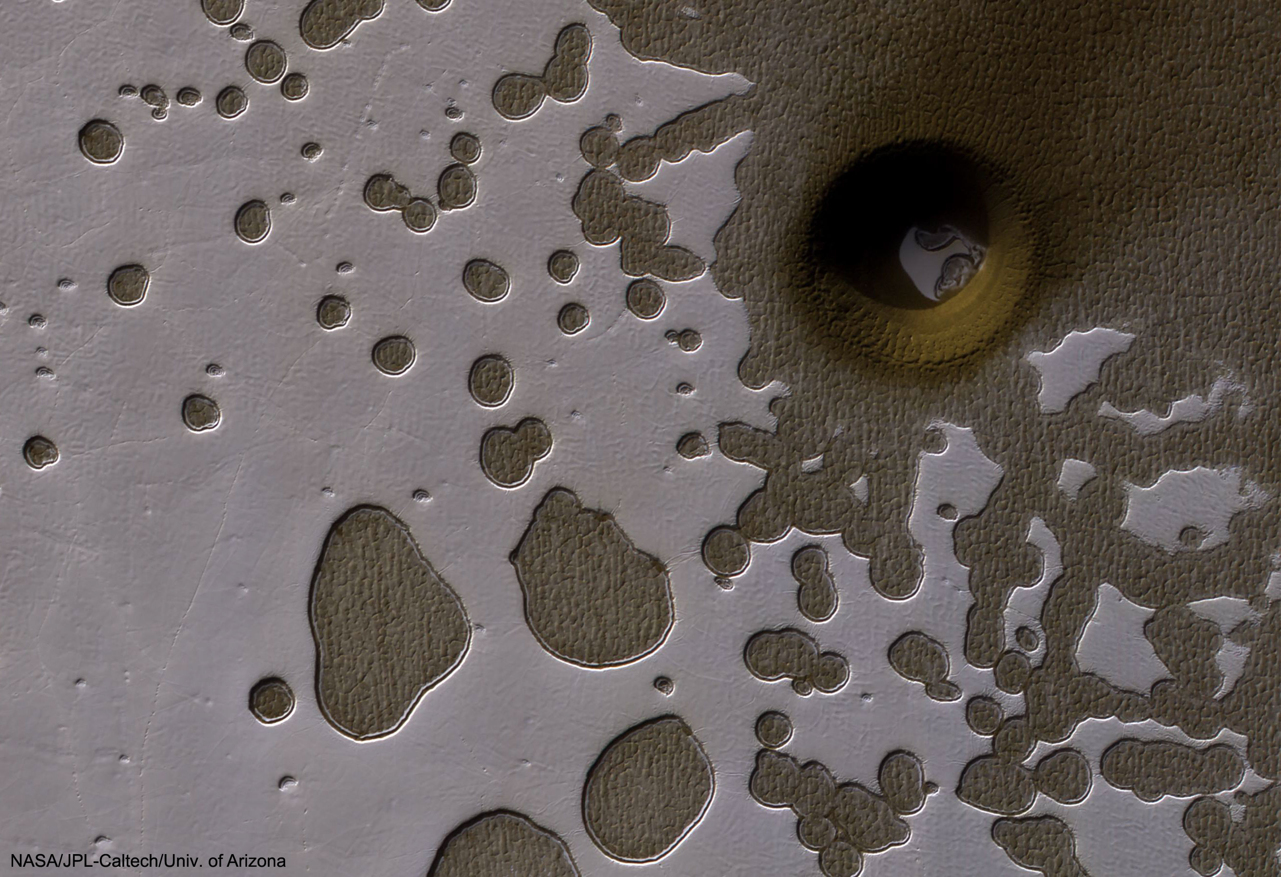 APOD: 2017 June 12 – An Unusual Hole in Mars
