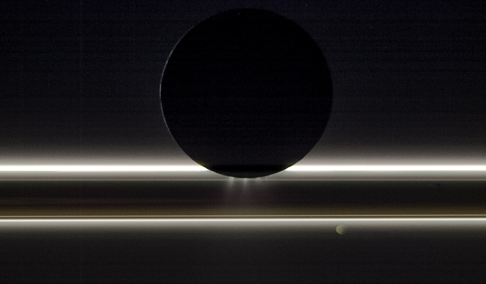 APOD: 2018 February 15 – Enceladus in Silhouette