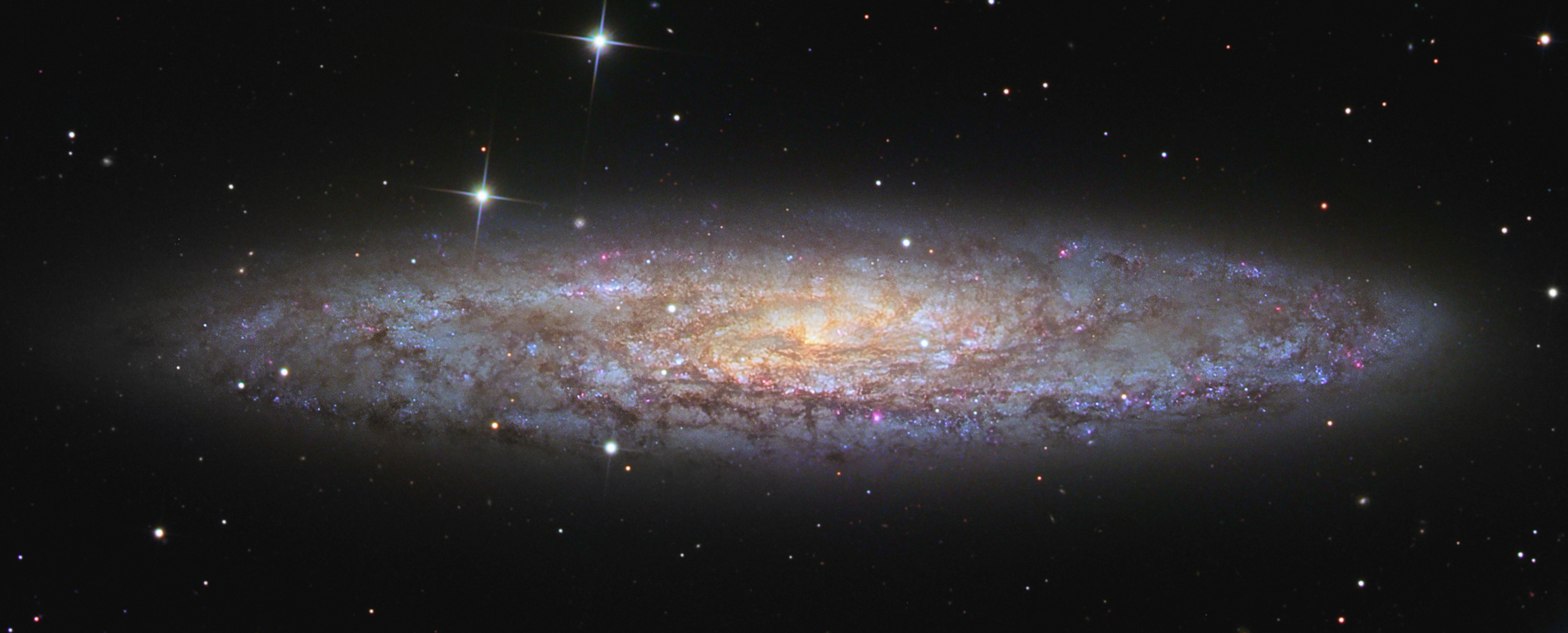 APOD: 2018 March 22 – NGC 253: Dusty Island Universe