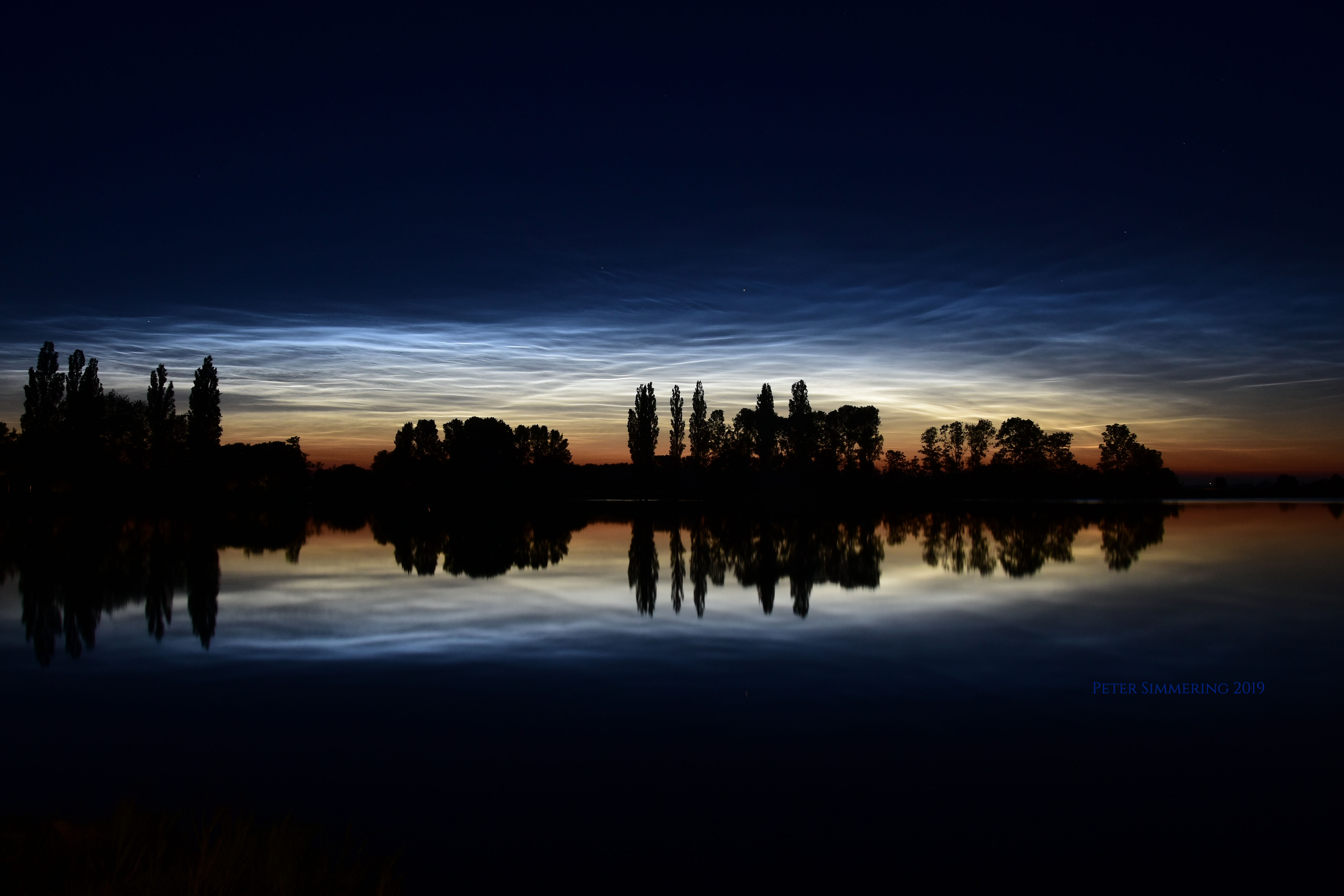 APOD: 2019 June 26 – Noctilucent Clouds, Reflections, and Silhouettes