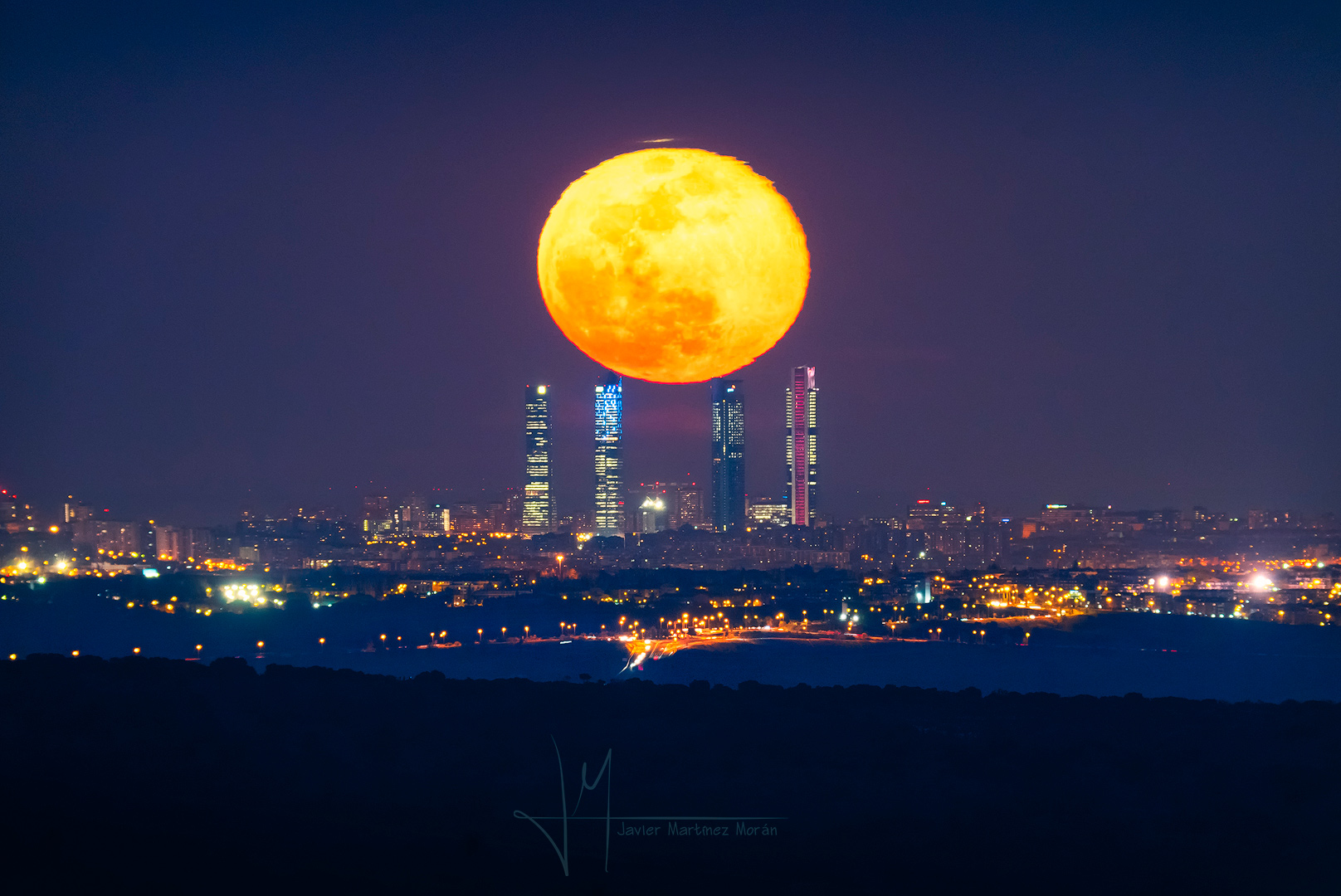 APOD: 2019 March 23 – Four Towers and the Equinox Moon
