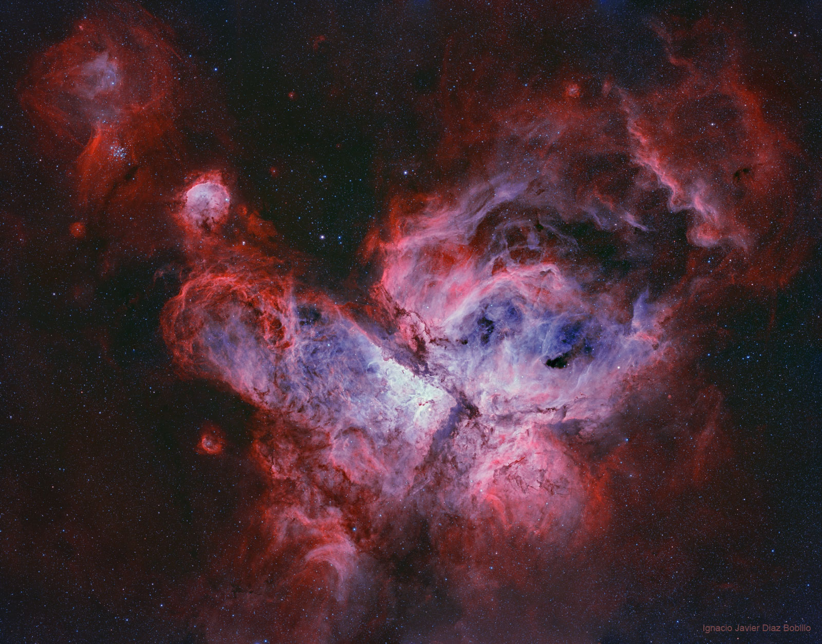 The featured image shows a central region of IC 2944, the Running Chicken Nebula. Visible are stars and dense clouds that form stars one day. Please see the explanation for more detailed information.