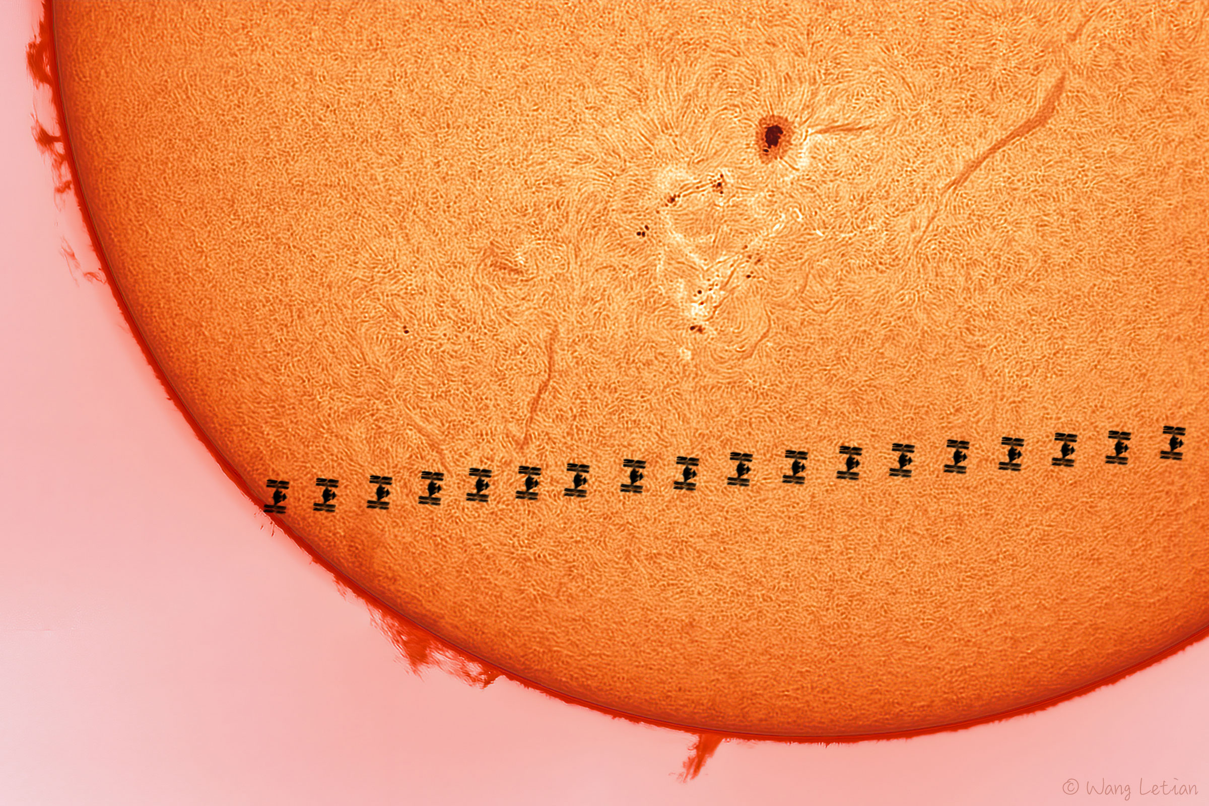 The featured image shows a time-lapse silhouette of the International Space Station (ISS) crossing the face of the Sun. The Sun shows filaments, prominences and a sunspot. Please see the explanation for more detailed information.