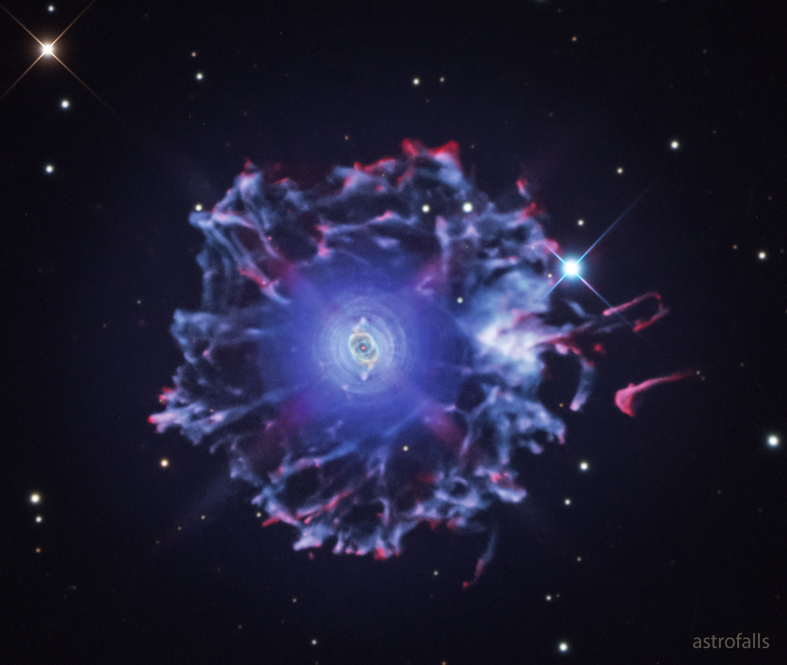 The featured image shows a wide field image of the Cat's Eye nebula showing it to be surrounded by a large halo with many vertexes. Please see the explanation for more detailed information.