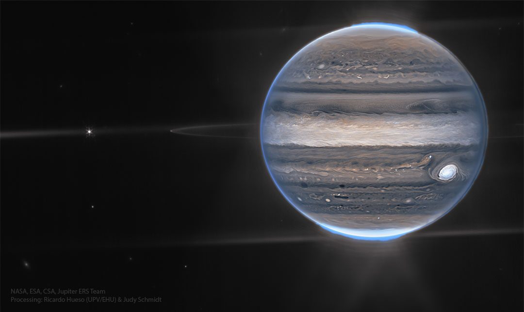 The featured image shows Jupiter in infrared light as captured by the James Webb Space Telescope. Visible in unusually dark colors are Jupiter's clouds including the Great Red Spot, a ring, several moons, and bright aurora. Please see the explanation for more detailed information.