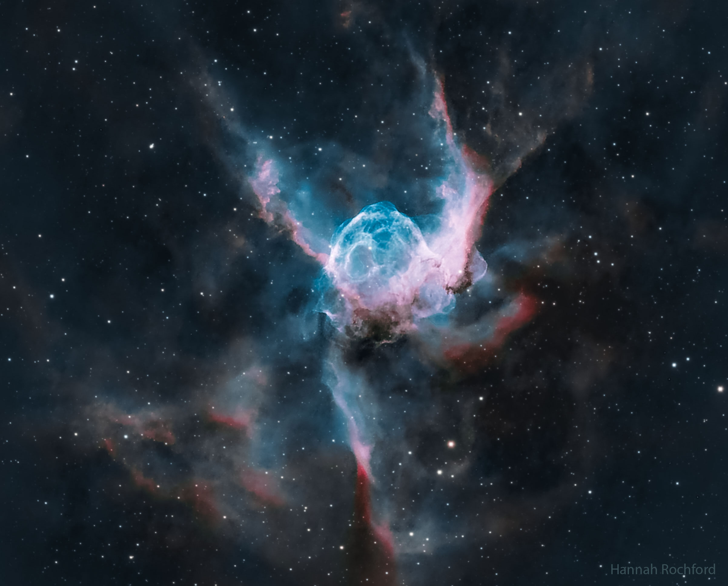 The featured image shows a nebula in blue and red that looks like a helmet. Please see the explanation for more detailed information.